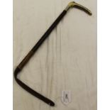 A lady's riding crop with antler handle and silver collar,