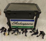 A Shakespeare fisherman's seat box containing a quantity of fixed spool reels and a multiplying