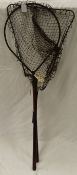 A teardrop shaped trout landing net,