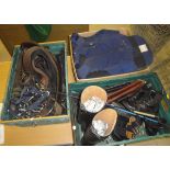 Three boxes of assorted riding equipment to include various bits, stirrups, body armour, crops,