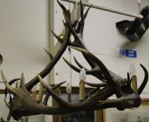 A red antler chandelier of circular form