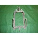 A Victorian cast iron bridle hook inscribed "Cottam & Compt Winsley Street,