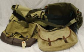 A collection of five assorted canvas fishing bags