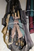 A Crane rod holdall containing a quantity of bank sticks and landing net handles,