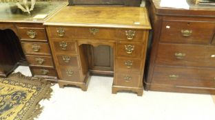 A 19th Century walnut and cross banded kneehole desk,