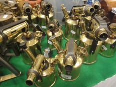 A collection of ten vintage brass blow torches, including Monitor No.