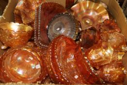 A box containing twenty-three pieces of copper lustre carnival glassware