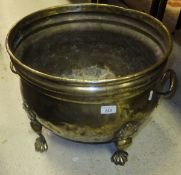 A 19th Century Dutch brass wine cooler of Bombe form raised on four paw feet