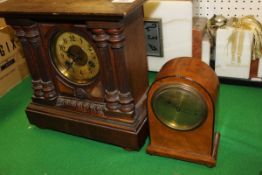 A mahogany mantel clock with Arabic numerals to the dial,