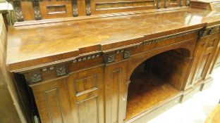A Victorian mahogany pedestal style sideboard with cupboard doors and central open recess,