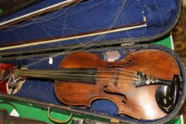 A late 19th Century violin and two bows in ebonised wooden case CONDITION REPORTS