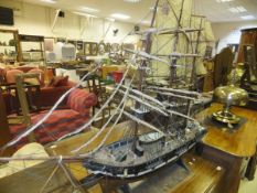 A mid 20th century hand built painted wooden model of a three masted sailing vessel