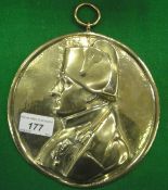 A 19th Century brass wall plaque decorated with a bust of Napoleon