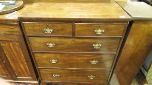 An early 19th Century mahogany and cross-banded chest of two short over three long drawers,