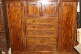 A Victorian mahogany break front wardrobe compactum,