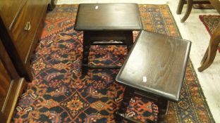 A pair of 20th Century joined oak stools in the 17th Century style and an oak framed oval wall