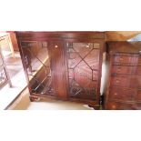 A mahogany bookcase with astragal glazed doors to bracket feet