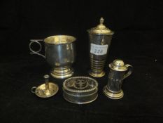 A collection of silver comprising an early 20th Century silver sugar caster in the Art Deco taste