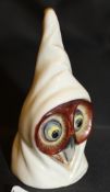 A Royal Worcester candle snuffer "Hooded Owl" date marked for 1909