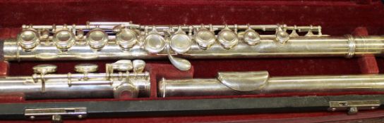 A silver plated "Jupiter" flute by K H Musical Instrument Co Ltd cased with leatherette carrier