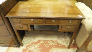 A 19th Century mahogany writing table with moulded edge over two long and two short drawers,