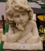 An early 20th Century carved marble figure of a child in pensive mood leaning upon a cushion,