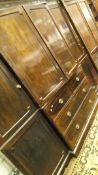 A Victorian mahogany break front wardrobe compactum the centre section with two cupboard doors