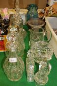 Five various cut glass decanters and stoppers, four small decanters/scent bottles, water jug,