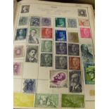 A box containing a collection of assorted 20th Century stamps of the world