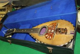 A rosewood mother of pearl and tortoiseshell inlaid mandolin by Domenico Zanoni of Napoli,