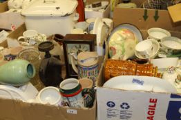 Four boxes of sundries to include china and glassware, commemorative mugs,