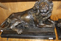 AFTER ANTOINE LOUIS BARYE "Snarling recumbent lion", bronze, with chocolate brown patination,