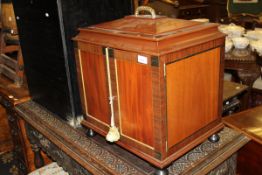 A modern mahogany and cross banded cutlery cabinet in the Regency style,