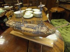 A mid 20th Century hand built wooden model of a three masted sailing vessel