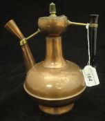 A circa 1900 Benham & Froud of London copper and brass coffee pot, raised on a circular foot,