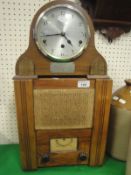 An AC Model wartime civilian receiver and a walnut cased dome topped mantel clock with plaque