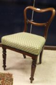 A set of six Victorian mahogany kidney-backed dining chairs with upholstered seats on turned and