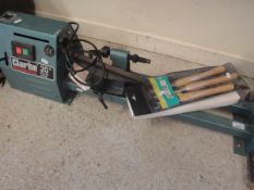 A Clarke woodworker 20" wood lathe together with two packs of chisels