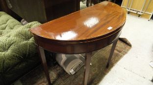 An early 19th Century mahogany and rosewood cross-banded ebony and satinwood strung card table of