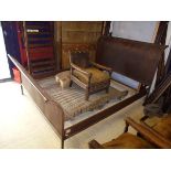 An iron framed king size sleigh bed