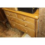 A pine chest of two short and two long drawers to bracket feet