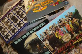 A box of various LP records including The Beatles "St.