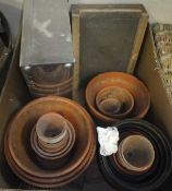 A leather suitcase, three various baskets, box of plant pots,