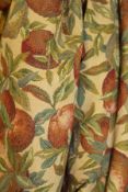 A pair of interlined curtains, the cream ground with fruit and foliate decoration,