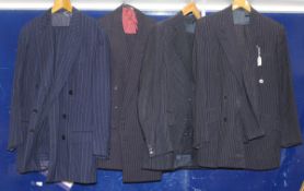 A collection of gentlemen's pinstripe and other suits, one by Gieves & Hawkes,