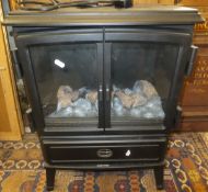 A Dimplex Model OKT20 electric simulated log burner CONDITION REPORTS Has general