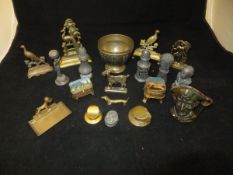 A box of various metal ware to include a bronze pirate jug, pewter peppers, military cap inkwell,