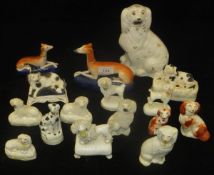 A collection of 15 19th Century Staffordshire dog figures including two greyhound inkwells,