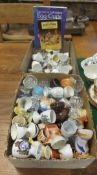 Two boxes of various china and glass egg cups various,