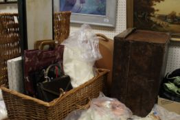 A collection of items to include a wicker hamper containing assorted linen, leather gloves,